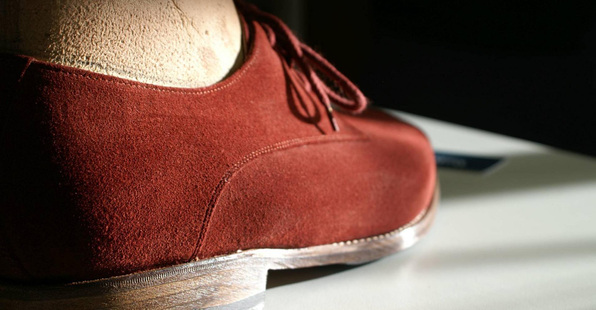 Handmade orthopaedic shoe in red